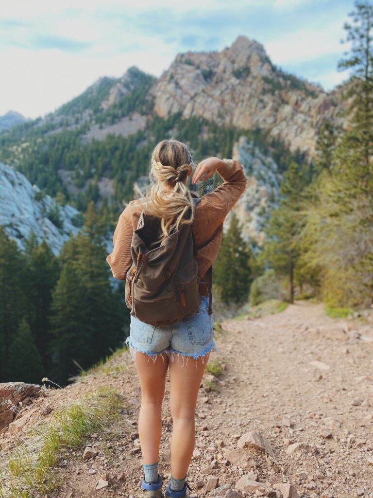 girl facing a mountain range 